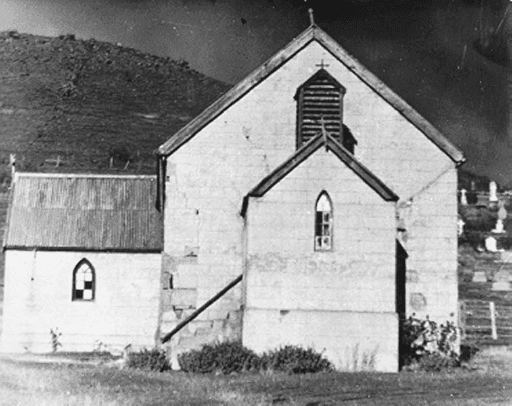 Close up view of the Catholic Church at Hamilton (now demolished), with the cemetery visible in the background. Tasmanian Archives